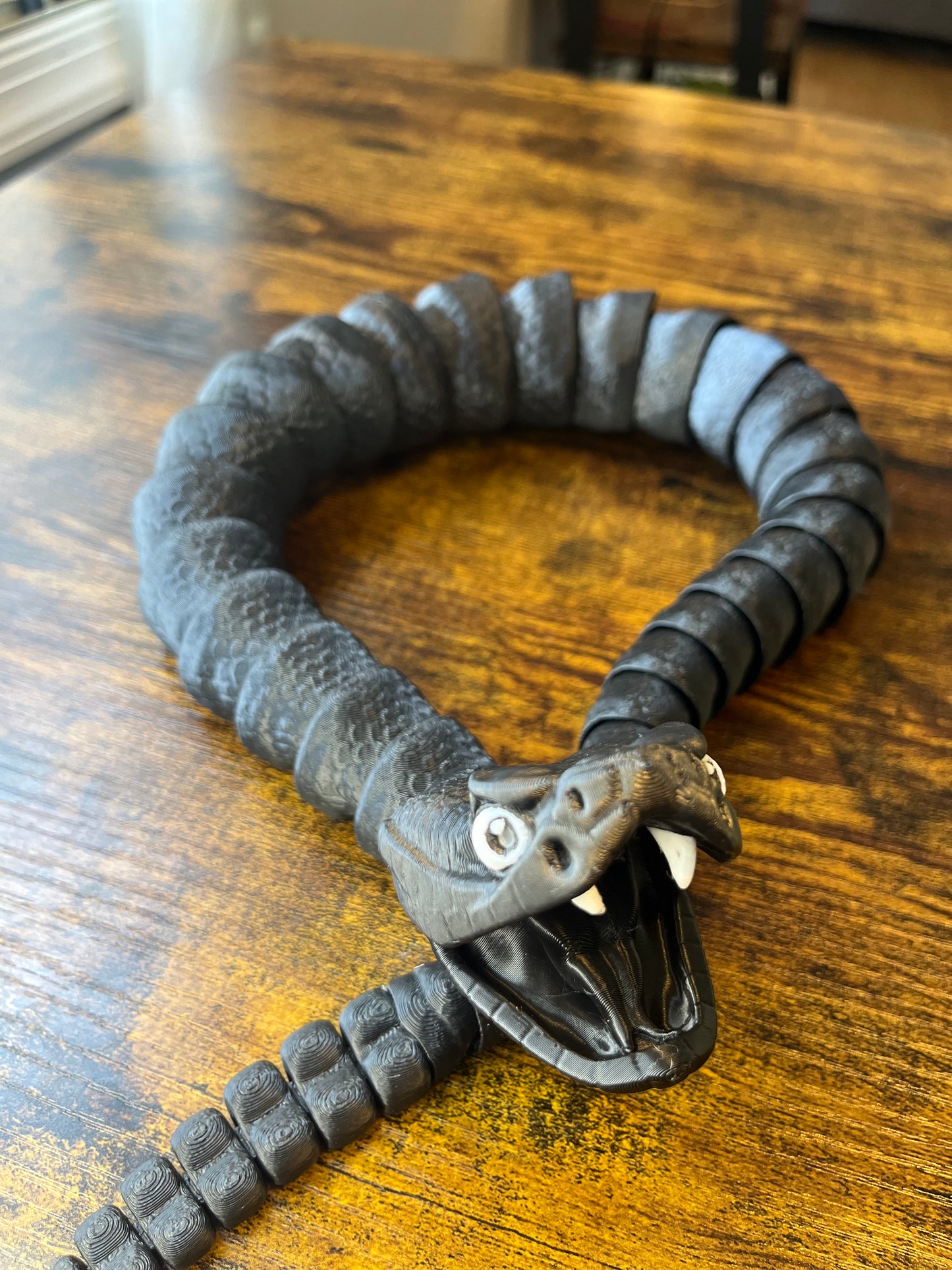 Articulated rattlesnake fidget/flexi